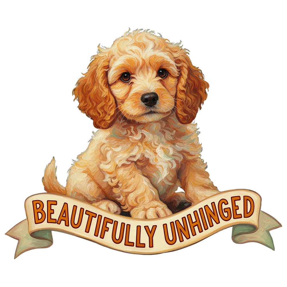 fluffy golden cockapoo puppy sitting upright